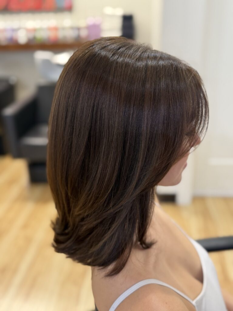 sleek chocolate brunette gloss and single-process color by a stylist at willow hair, eugene OR